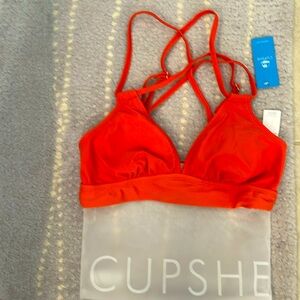 Cupshe bikini top with double adjustable straps and back crisscross detail.